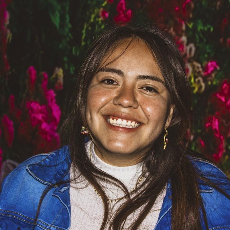 Kaveri Mehta, Lead Design Curator at SimpleBalanceWay, reviewing corporate floral arrangements